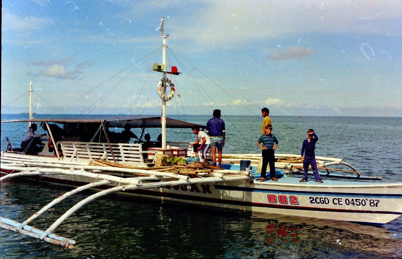 An outrigger boat at the water’s edge, 1990–1993.