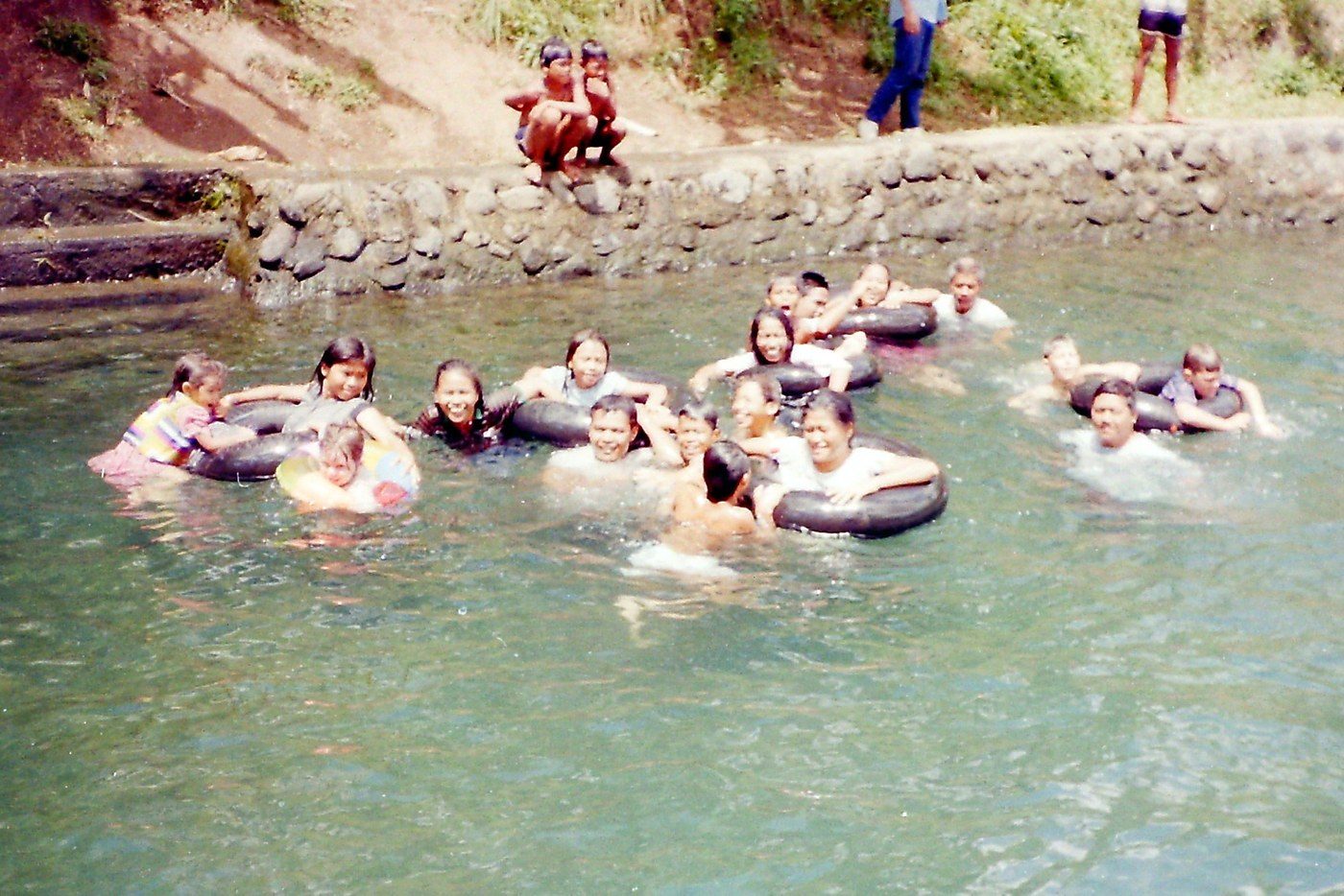 Floating in inner tubes where I first learned how to swim, 1989–1990.