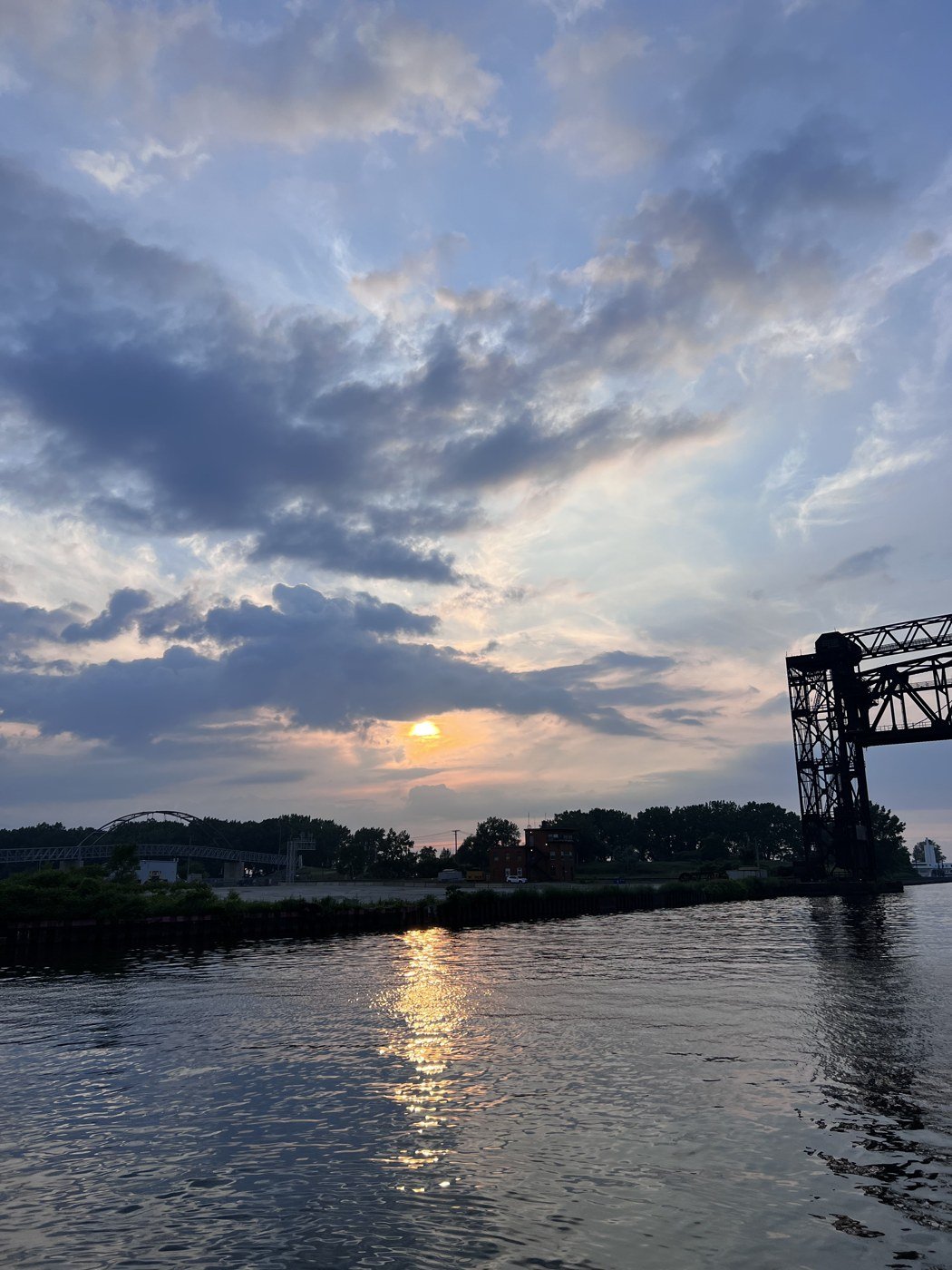The sun going down over the river, June 2022.