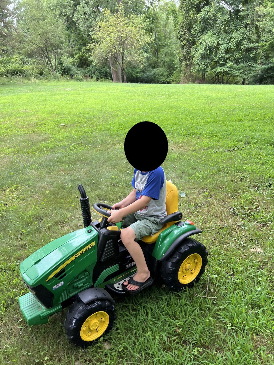 One of my boys on his tractor, August 2022, the other picture I sent.
