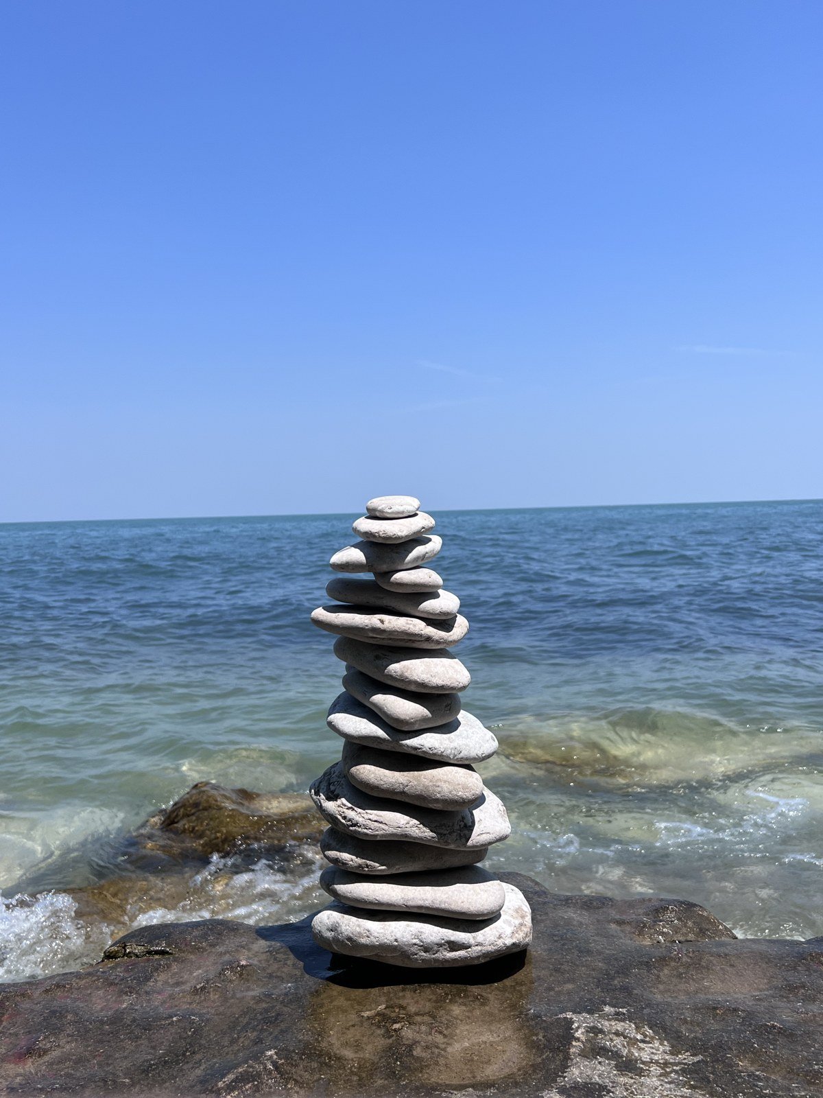 Stones by the lake, June 2023.